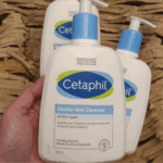 Hand holding Cetaphil Gentle Skin Cleanser for sensitive skin 500ml bottle available in Sri Lanka
