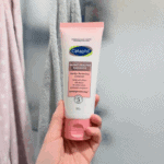 Hand holding Cetaphil Healthy Radiance Gentle Renewing Cleanser 100g for sensitive skin in Sri Lanka