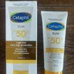Cetaphil Sun SPF 50+ Light Gel sunscreen 100ml with outer box and tube displayed on wooden surface – very high protection broad spectrum sunscreen for sensitive skin in Sri Lanka