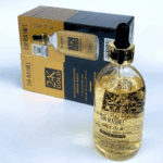 Dr Rashel 24K Gold Radiance and Anti-Aging Primer Serum bottle with visible gold flakes, placed in front of its black and gold packaging box on a white background, showing the dropper cap and premium skincare branding clearly.