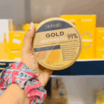 Dr Rashel gold soothing gel 99 percent 300g jar held in hand with store display background in Sri Lanka