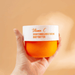 Dr Rashel vitamin C brightening and moisturizing body butter jar held in hand in Sri Lanka