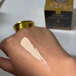 Dr Rashel Whitening Cream 24K Gold Collagen 30ml texture applied on hand, brightening gold collagen face cream showing consistency available in Sri Lanka