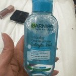 Hand holding Garnier Micellar Cleansing Water Salicylic BHA 125ml bottle for oily acne prone skin makeup remover Sri Lanka
