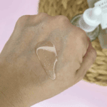 SKIN1004 Madagascar Centella Tone Brightening Capsule Ampoule texture swatched on hand showing capsule beads