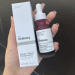 Hand holding The Ordinary AHA 30% BHA 2% Peeling Solution 30ml dropper bottle with packaging box exfoliating facial serum Sri Lanka
