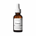 Studio product shot of The Ordinary Retinol 0.5% in Squalane amber glass bottle with white dropper on neutral background.