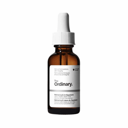 Studio product shot of The Ordinary Retinol 0.5% in Squalane amber glass bottle with white dropper on neutral background.