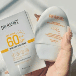 Dr Rashel Moisture Sunscreen SPF 60 60g Sri Lanka anti-aging sun cream bottle and box packaging displayed in hand, SPF 60+ protection with moisturizing formula.