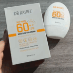 Dr Rashel Moisture Sunscreen SPF 60 60g Sri Lanka anti-aging moisture sun cream bottle and box packaging placed on wooden surface with SPF 60++ protection.