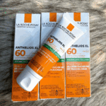 La Roche-Posay Dry Touch Gel Cream SPF 60 50ml Anthelios XL anti-shine sunscreen tube displayed with retail boxes showing broad-spectrum SPF 60 protection for face. Select 65 more words to run Humanizer.