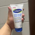 Cetaphil Extra Gentle Daily Scrub Held in Hand
